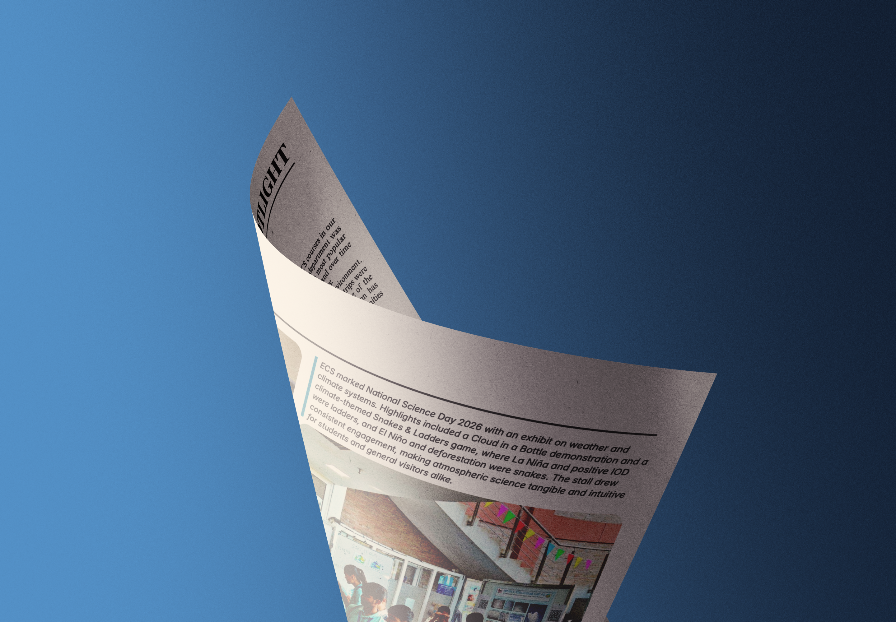 A curled GeoPulse publication page against a blue backdrop
