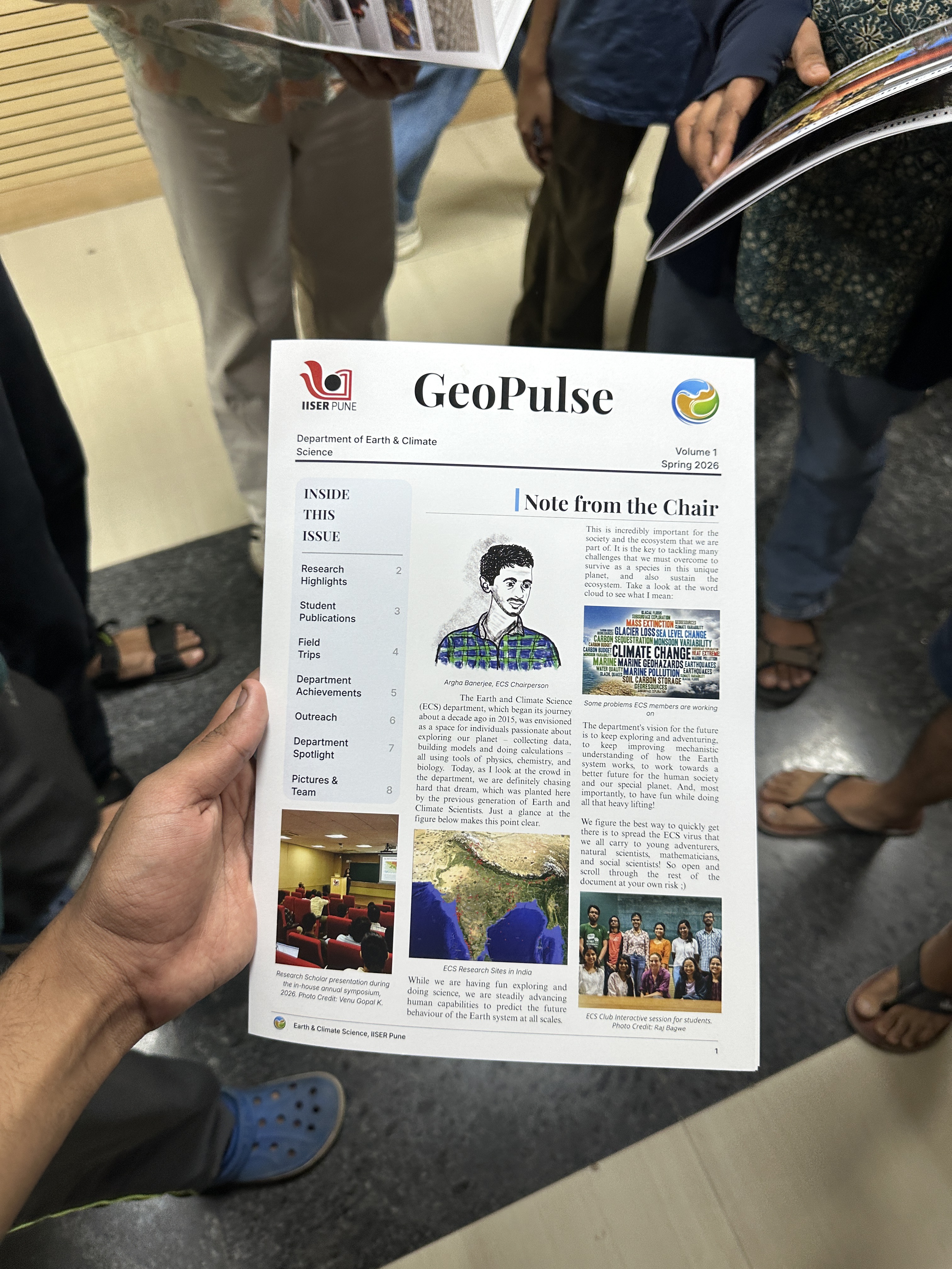 A printed GeoPulse newsletter at the publication event