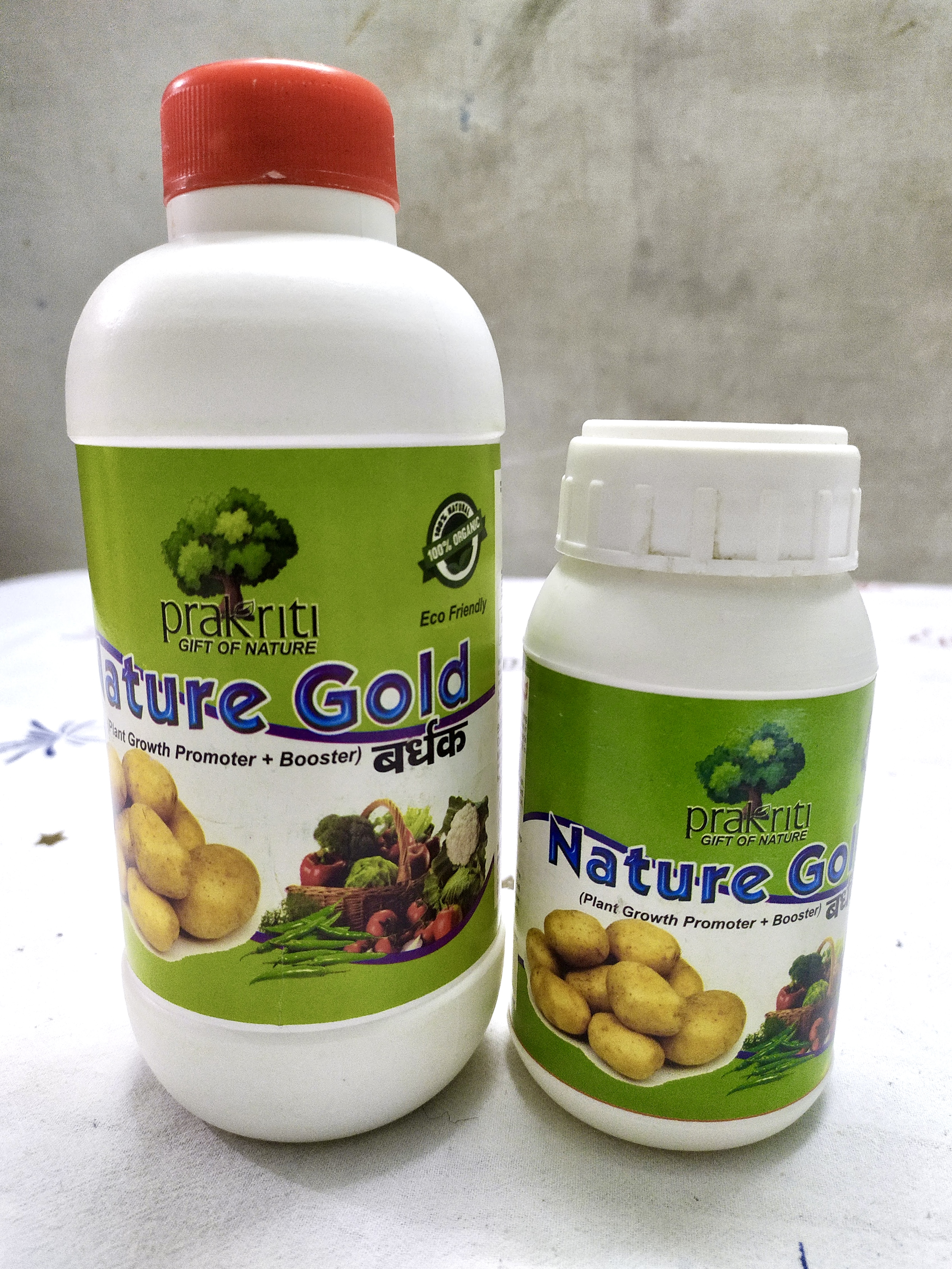 Nature Gold labels on two bottle sizes